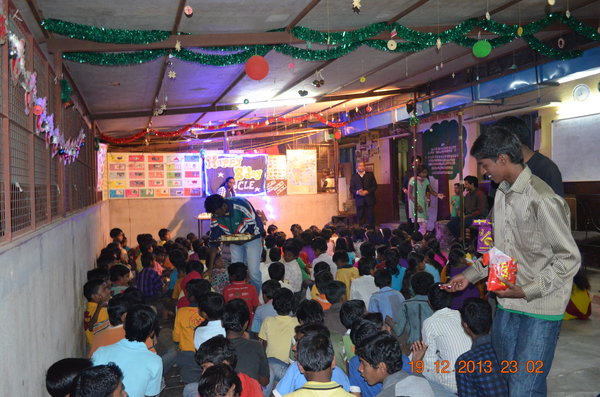 Giving out sweets to the children